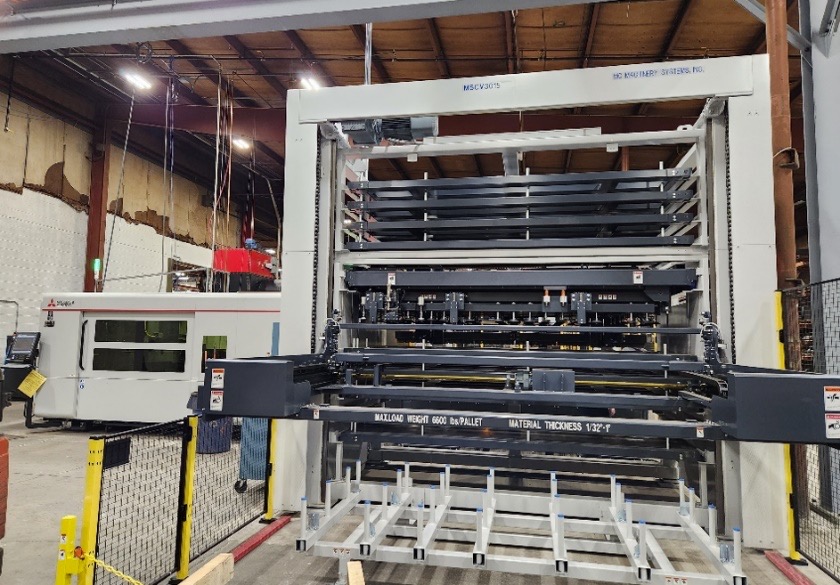 Laser cutting cell with automated material load tower